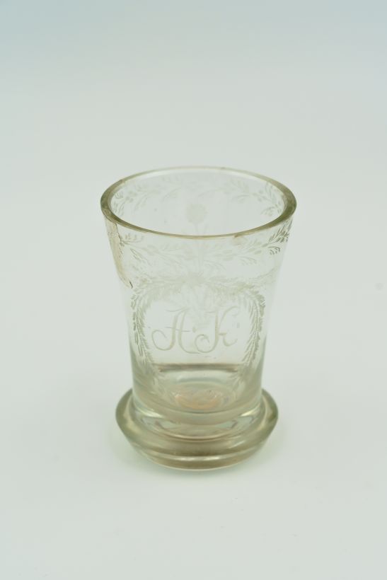 Coin tumbler with the initials A. K.